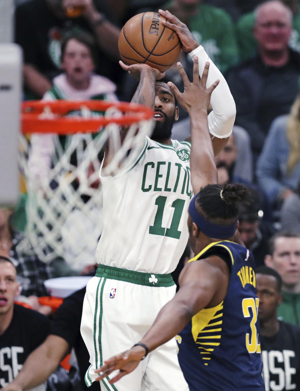Boston Celtics guard Kyrie Irving (11) shoots over Indiana Pacers center Myles Turner (33) during the first quarter of Game 2 of an NBA basketball first-round playoff series, Wednesday, April 17, 2019, in Boston. (AP Photo/Charles Krupa)