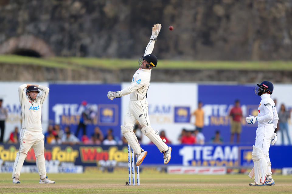 New Zealand's wicketkeeper Tom Blundell jumps high trying to reach the ball on the third day of the first cricket test match between New Zealand and Sri Lanka in Galle, Sri Lanka, Friday, Sept. 20, 2024. (AP Photo/Viraj Kothalawala)