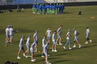 Players from England, bottom and Pakistani, top, attend a training session, in Rawalpindi, Pakistan, Monday, Nov. 28, 2022. England's team arrived in Pakistan to play three-test cricket matches starting from Dec. 1. (AP Photo/Anjum Naveed)