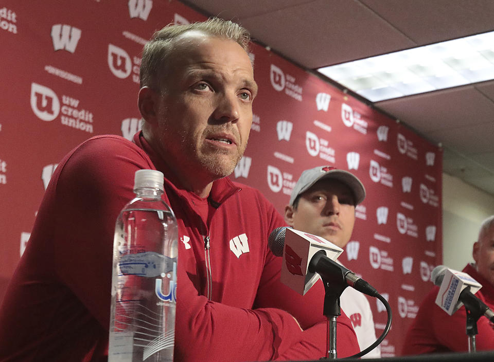 FILE - University of Wisconsin athletic director Chris McIntosh, left, and football defensive coordinator Jim Leonhard address reporters during a news conference announcing the firing of head coach Paul Chryst in Madison, Wis. Sunday, Oct. 2, 2022. McIntosh’s emergence as Wisconsin’s athletic director after playing football for the Badgers and working as predecessor Barry Alvarez’s right-hand man seemed to indicate things would stay essentially the same at a school that prides itself on stability. It hasn’t worked out that way. (John Hart/Wisconsin State Journal via AP, File)