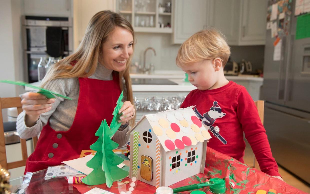 Anna Tyzack making a cardboard gingerbread house with her son Alfie - Copyright Â©Heathcliff O'Malley , All Rights Reserved, not to be published in any format without p