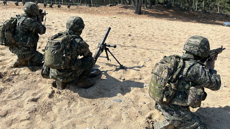South Korean Marines look inland after a beach landing rehearsal for Exercise Ssang Yong on March 28 in Pohang, South Korea. - Brad Lendon/CNN