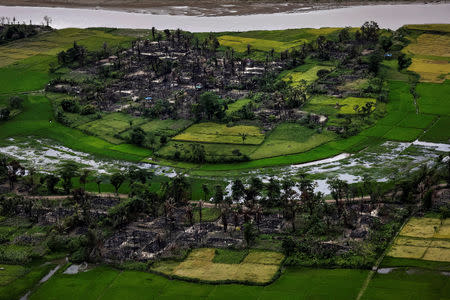 FILE PHOTO: The remains of a burned Rohingya village is seen in this aerial photograph near Maungdaw, north of Rakhine State, Myanmar September 27, 2017. REUTERS/Soe Zeya Tun/File Photo