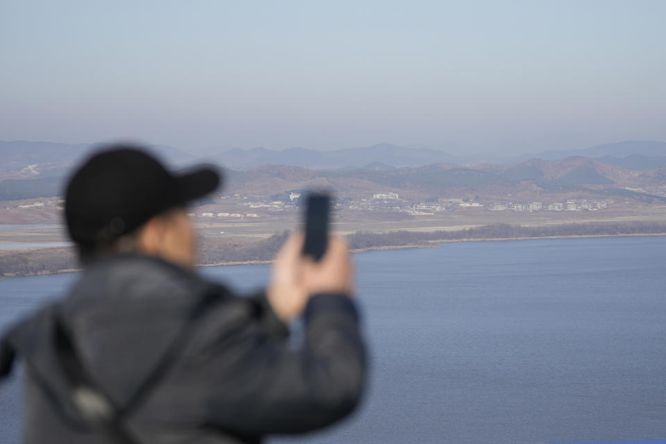 A visitor looks at the northern side from the unification observatory in Paju, South Korea, Tuesday, Jan. 16, 2024. North Korean leader Kim Jong Un said his country would no longer pursue reconciliation with South Korea and called for rewriting the North’s constitution to eliminate the idea of shared statehood between the war-divided countries, state media said Tuesday. (AP Photo/Lee Jin-man)