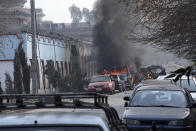<p>Vehicles burn after a deadly suicide attack in Jalalabad, east of Kabul, Afghanistan, Wednesday, Jan. 24, 2018. Attahullah Khogyani, spokesman for the provincial governor said a group of gunmen stormed the office of the non-governmental organization, Save the Children. (Photo: AP) </p>