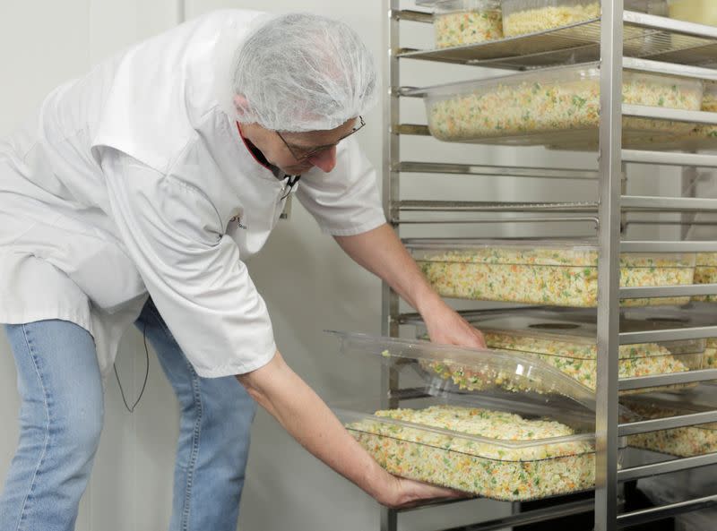 An employee prepares food at AZ Groeninge Hospital in Kortrijk