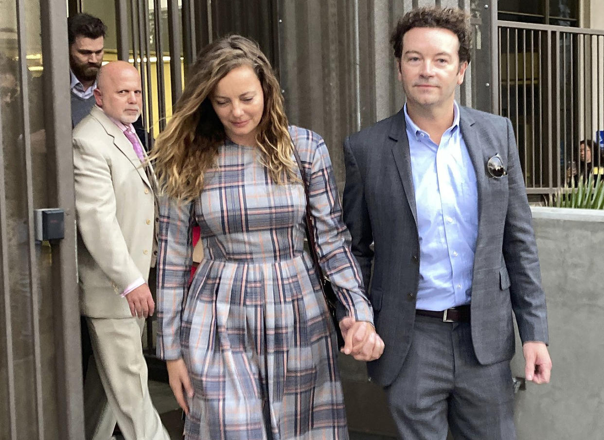 Actor Danny Masterson leaves Los Angeles superior Court with his wife, Bijou Phillips, on Nov. 30, 2022.   (Brian Melley / AP)