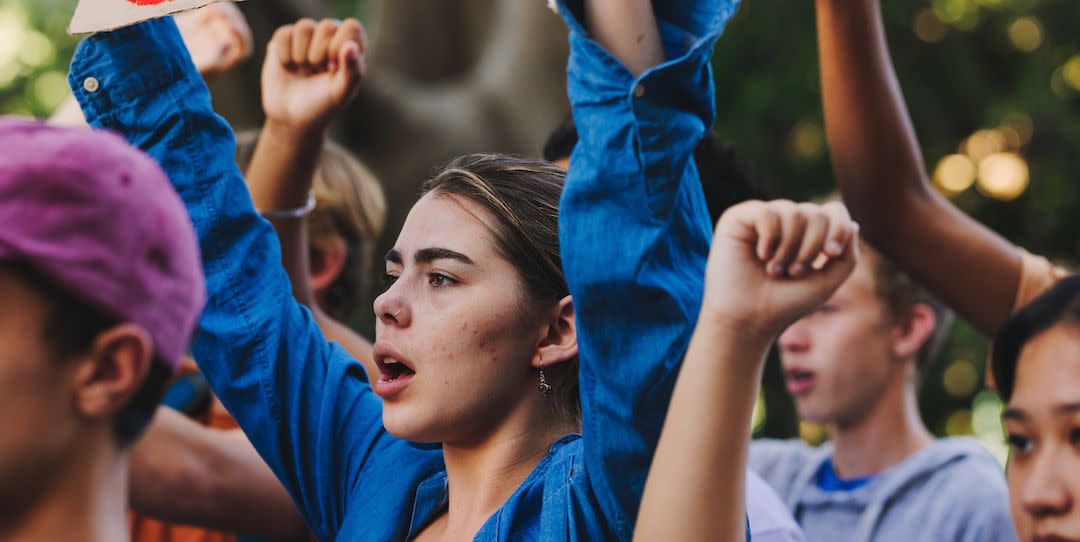 teenagers campaigning group of multicultural youth activists marching diverse young people