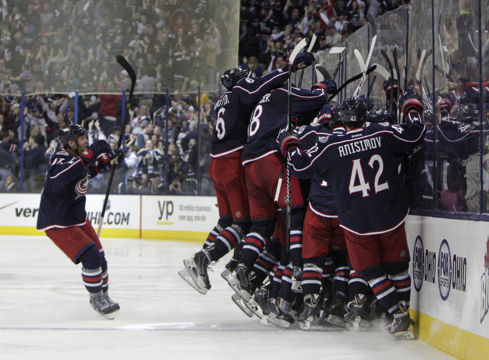 Columbus Blue Jackets celebrate their win over the Pittsburgh Penguins in Game 4 of a first-round NHL playoff hockey series Wednesday, April 23, 2014, in Columbus, Ohio. The Blue Jackets defeated the Penguins 4-3 in overtime. (AP Photo/Jay LaPrete)