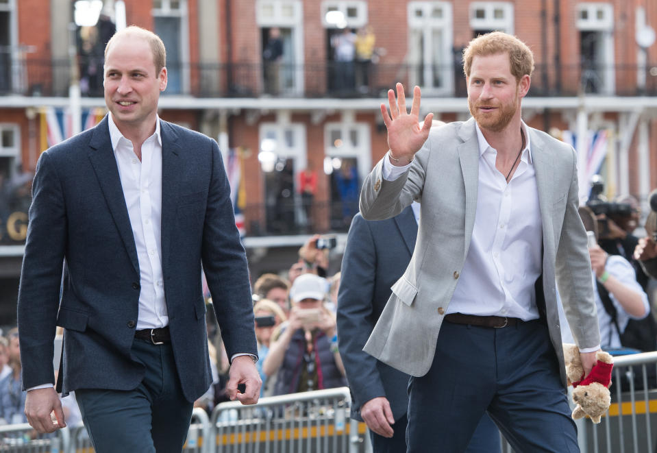 Prince Harry and his best man the Duke of Cambridge greet well-wishers in Windsor on the eve of his wedding (Picture: Getty)