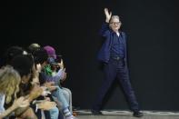Designer Paul Smith accepts applause at the conclusion of his menswear Fall-Winter 2023-24 collection presented in Paris, Friday, Jan. 20, 2023. (AP Photo/Thibault Camus)