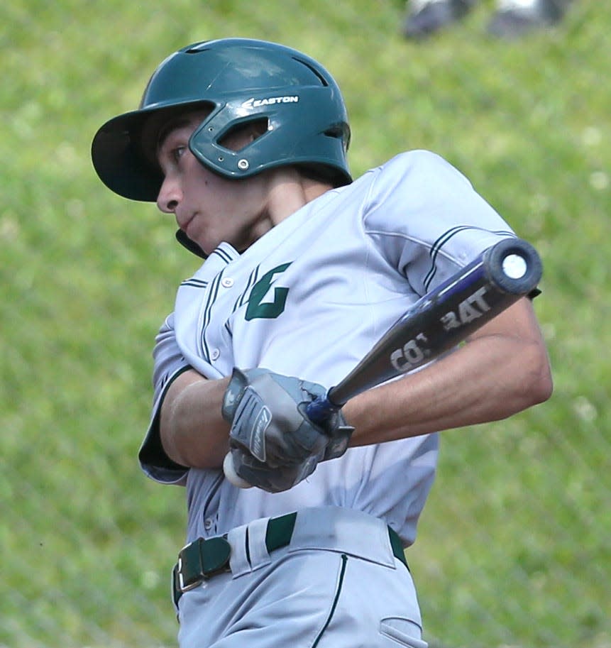 Dylan Rouse of Central Catholic drives in a run during their Division III regional semifinal against Berkshire at Massillon on Friday, June 4, 2021.