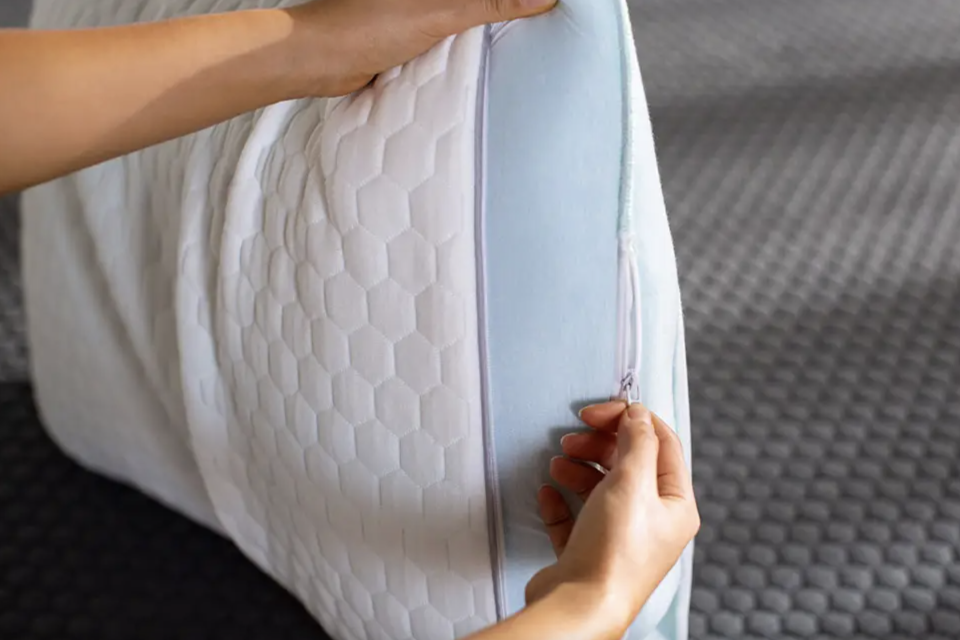 woman's hands on Layla Memory Foam Pillow (Photo via Layla Sleep)