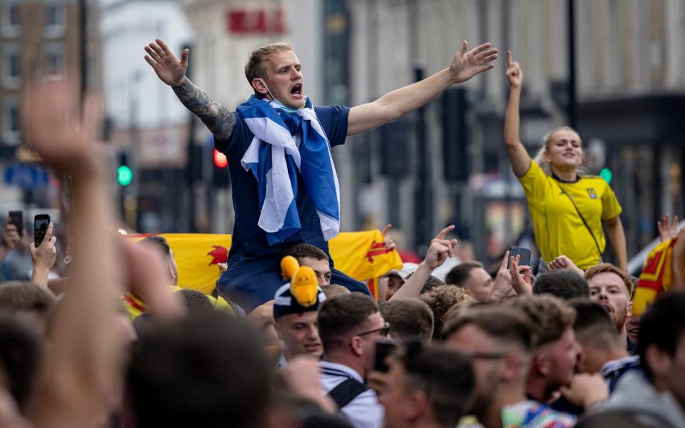 Scotland fans in full voice outside King's Cross station - GETTY IMAGES