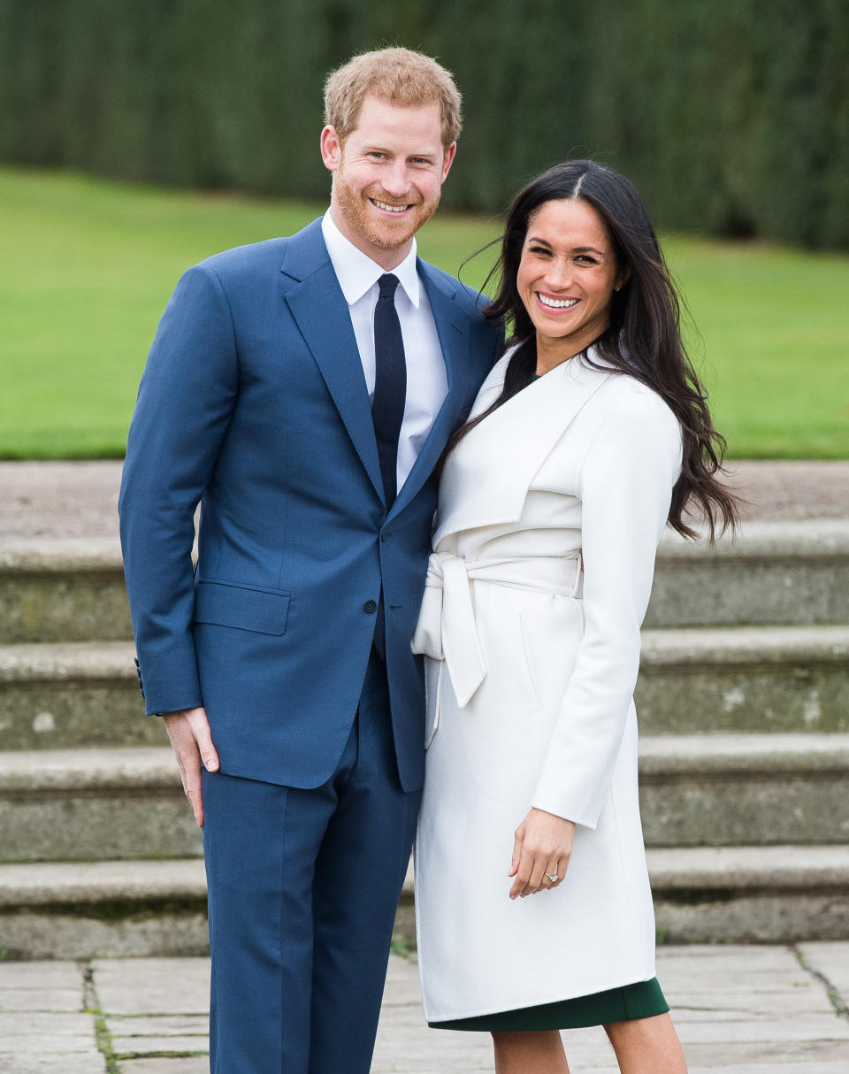 LONDON, ENGLAND - NOVEMBER 27:  Prince Harry and Meghan Markle during an official photocall to announce the engagement of Prince Harry and actress Meghan Markle at The Sunken Gardens at Kensington Palace on November 27, 2017 in London, England.  Prince Harry and Meghan Markle have been a couple officially since November 2016 and are due to marry in Spring 2018.  (Photo by Samir Hussein/Samir Hussein/WireImage)