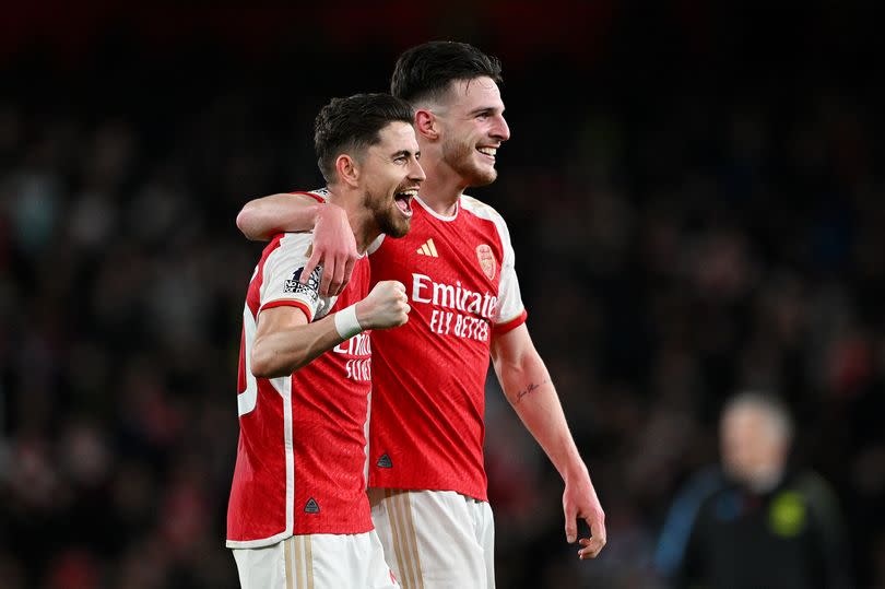 Jorginho and Declan Rice of Arsenal celebrate after the team's victory in the Premier League match between Arsenal FC and Liverpool FC at Emirates Stadium on February 04, 2024 in London, England.