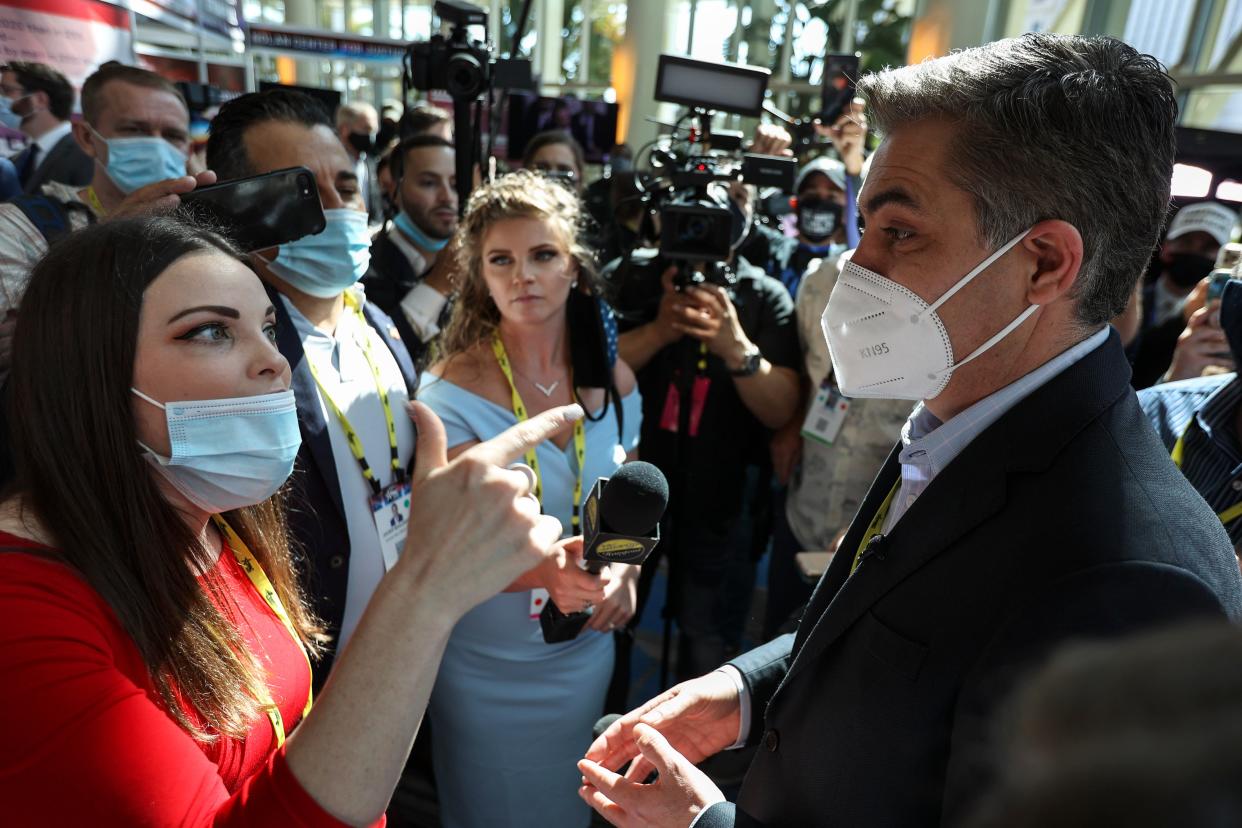 A woman argues with CNN reporter Jim Acosta outside CPAC on Friday, Feb. 26, 2021 in Orlando, Fla.  (Sam Thomas/Orlando Sentinel via AP) (AP)