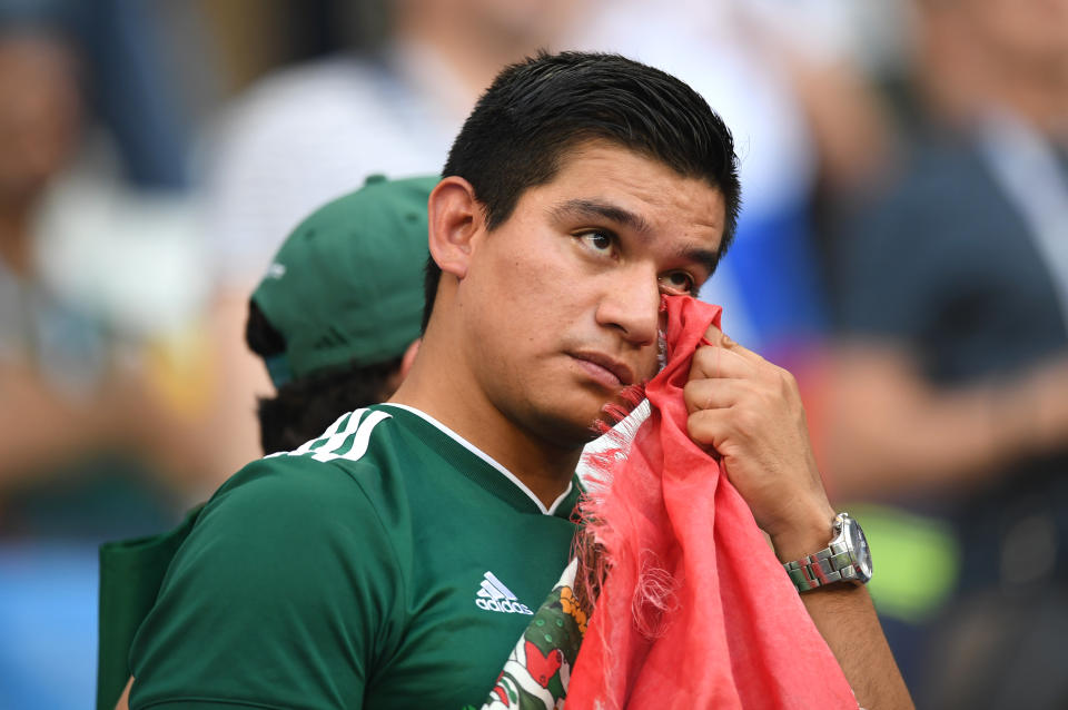 <p>A Mexico fan looks dejected following his sides defeat in the 2018 FIFA World Cup Russia Round of 16 match between Brazil and Mexico at Samara Arena on July 2, 2018 in Samara, Russia. (Photo by Matthias Hangst/Getty Images) </p>