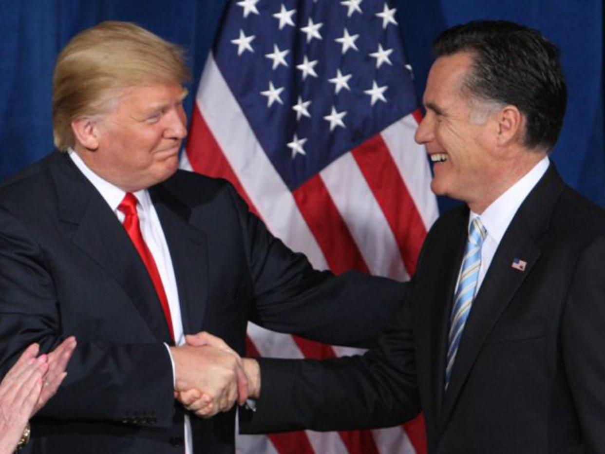 Trump greets Romney after endorsing his candidacy for president at the Trump Hotel in Las Vegas in February 2012: Reuters