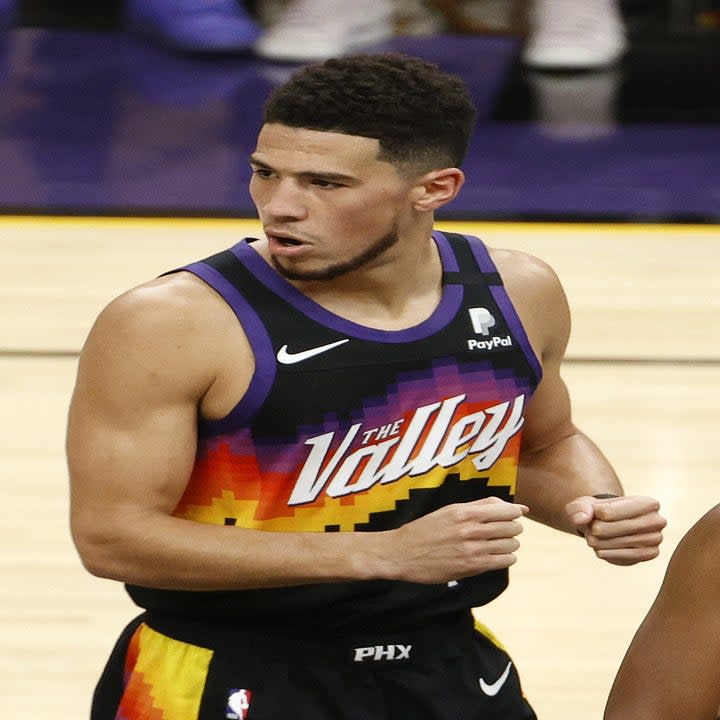 Devin Booker #1 of the Phoenix Suns celebrates against the Milwaukee Bucks during the first half in Game Two of the NBA Finals at Phoenix