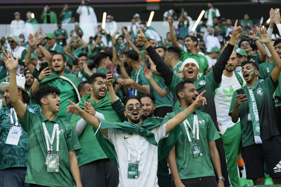 Saudi Arabia fans cheer prior of the World Cup group C soccer match between Poland and Saudi Arabia, at the Education City Stadium in Al Rayyan , Qatar, Saturday, Nov. 26, 2022. (AP Photo/Francisco Seco)