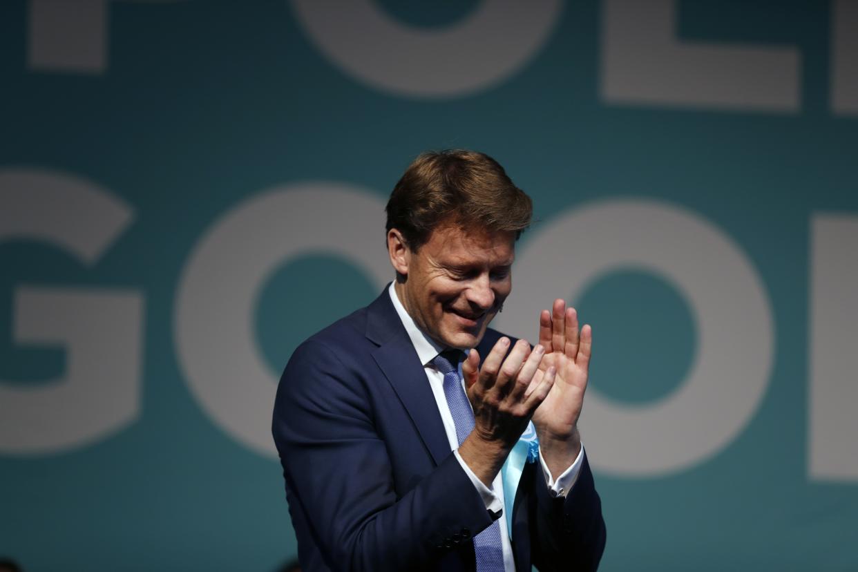 Brexit Party chairman Richard Tice applauds during a Brexit Party rally in London, Tuesday, May 21, 2019. Some 400 million Europeans from 28 countries head to the polls from Thursday to Sunday to choose their representatives at the European Parliament for the next five years. Farage's Brexit Party is leading opinion polls in the contest for 73 U.K. seats in the 751-seat European Parliament. (AP Photo/Frank Augstein)