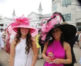 May 7, 2016; Louisville, KY, USA; Women in derby hats pose for a photo before the 142nd running of the Kentucky Derby at Churchill Downs. Mark Zerof