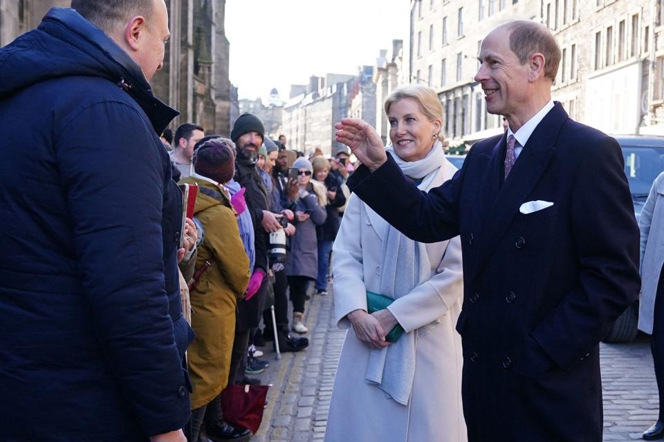 The new Duke and Duchess of Edinburgh, Britain's Prince Edward, Duke of Edinburgh (R) and Britain's Sophie, Duchess of Edinburgh (centre right) meet members of the public as they attend a ceremony at the City Chambers in Edinburgh to mark one year since the city's formal response to the invasion of Ukraine