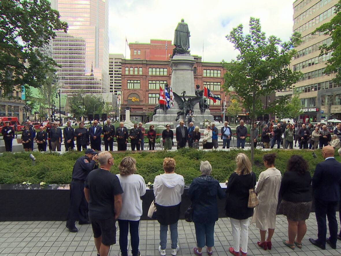 The city of Montreal held a ceremony Thursday to commemorate the 37 victims who died in the tragic fire at the Blue Bird Café and the Wagon Wheel Bar 50 years ago.   (CBC - image credit)