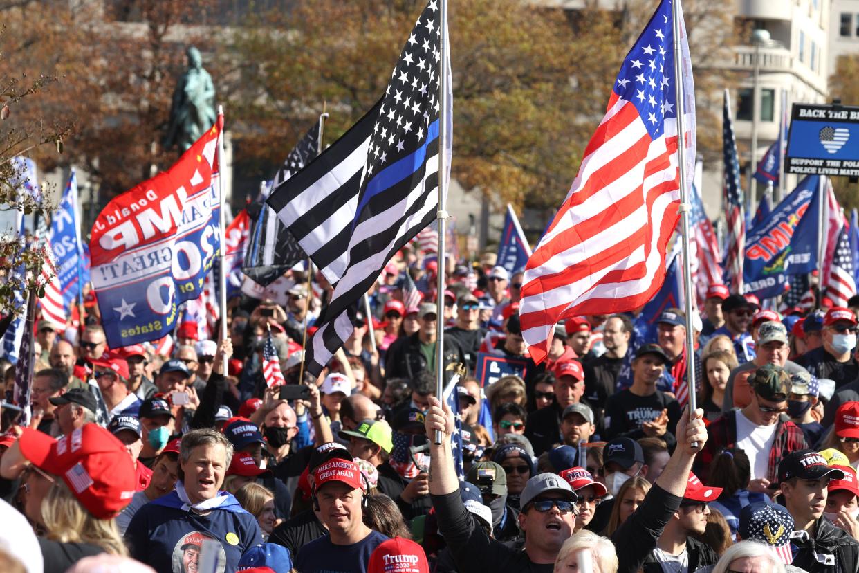 People participate in the “Million MAGA March” from Freedom Plaza to the Supreme Court, on November 14, 2020 in Washington, DC. Supporters of U.S. President Donald Trump marching to protest the outcome of the 2020 presidential election