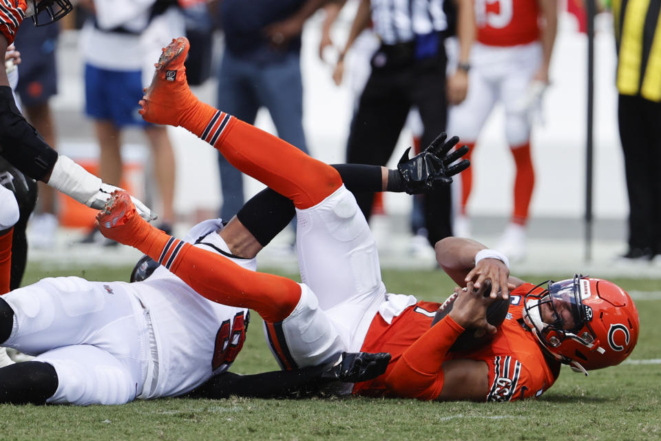 Chicago Bears quarterback Justin Fields (1) is sacked by Tampa Bay Buccaneers linebacker Joe Tryon-Shoyinka (9) during the second half of an NFL football game, Sunday, Sept. 17, 2023, in Tampa, Fla. (AP Photo/Scott Audette)