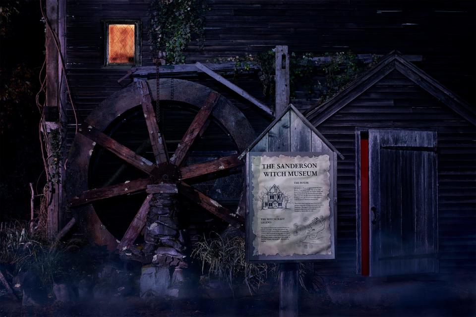 The exterior of the Sanderson sister's cottage includes a "water wheel."