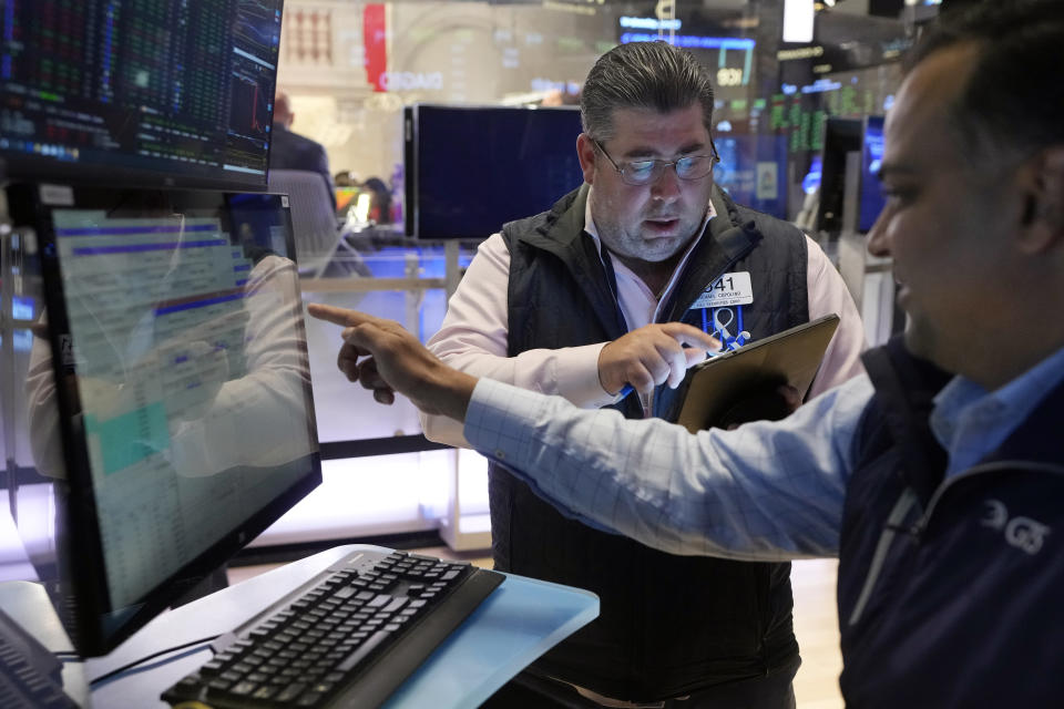 Trader Michael Capolino, left, and specialist Dilip Patel work on the floor of the New York Stock Exchange, Wednesday, June 12, 2024. U.S. stocks are rallying Wednesday following a surprisingly encouraging update on inflation. (AP Photo/Richard Drew)