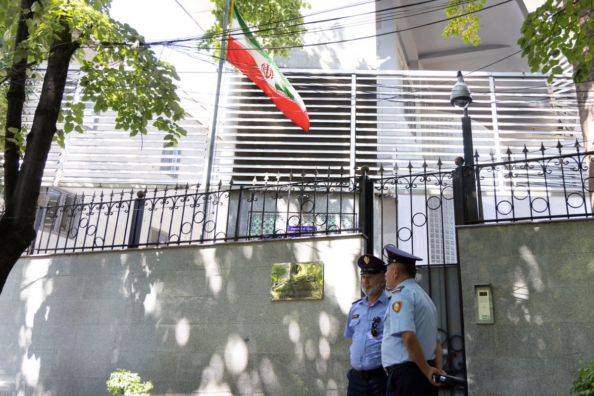 Policemen stand guard outside the Iranian embassy in Tirana (Reuters)