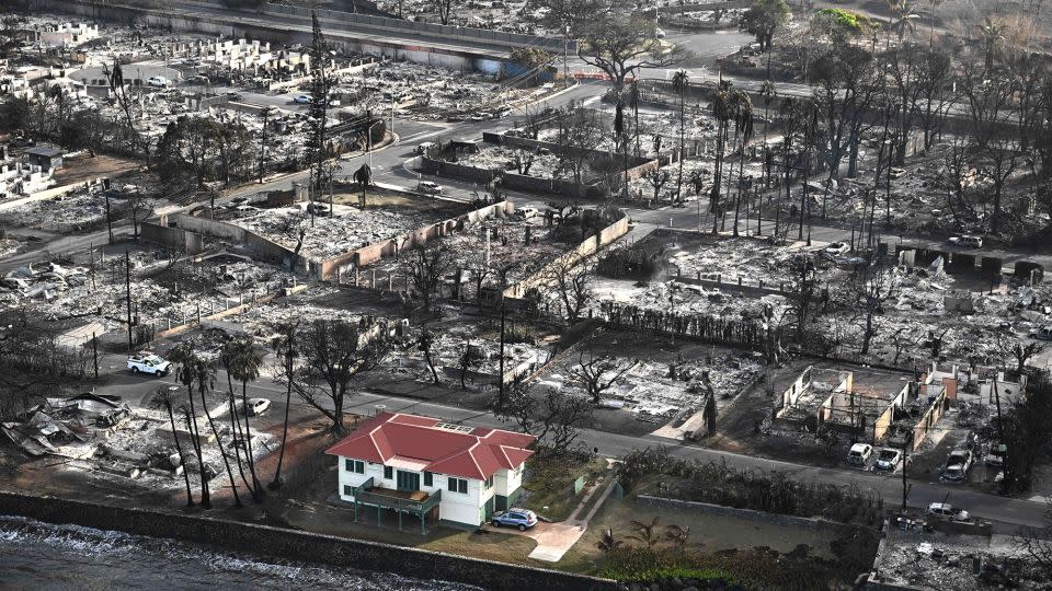 An aerial image shows destroyed homes and buildings in the aftermath of wildfires in Lahaina, Hawaii on August 10, 2023. The fires became a focus point for conspiracies and misinformation online. - Patrick T. Fallon/AFP/Getty Images
