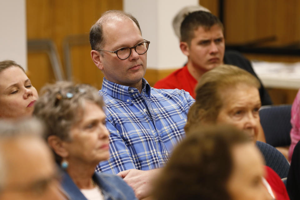 In this Tuesday, Oct. 15, 2019 photo, supporters of Virginia Del. Nick Freitas listen during a town hall in Lake of Woods, Va. Freitas is running a write in campaign after a paperwork error left his off the November ballot. (AP Photo/Steve Helber)