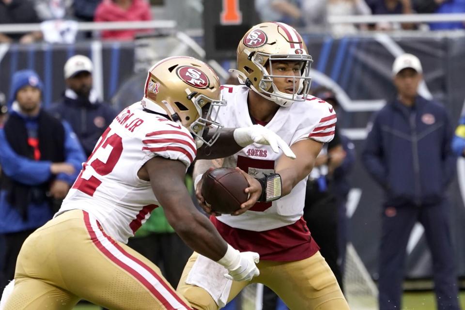 San Francisco 49ers quarterback Trey Lance hands off to running back Jeff Wilson Jr.