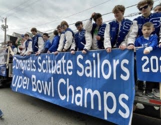 The Scituate football team at the St. Patrick's Day Parade on Front Street, Sunday, March 20, 2022.