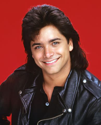 <p>Bob D'Amico/ABC via Getty </p> John Stamos is pictured as Jesse Katsopolis in a promotional still for 'Full House'.