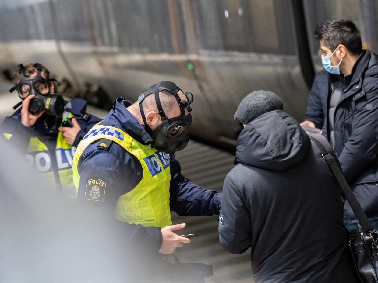 Travellers from Denmark are met by Swedish police after border was briefly closed (EPA)