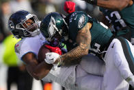 Tennessee Titans' Treylon Burks scores a touchdown in front of Philadelphia Eagles' Marcus Epps during the first half of an NFL football game, Sunday, Dec. 4, 2022, in Philadelphia. (AP Photo/Matt Slocum)