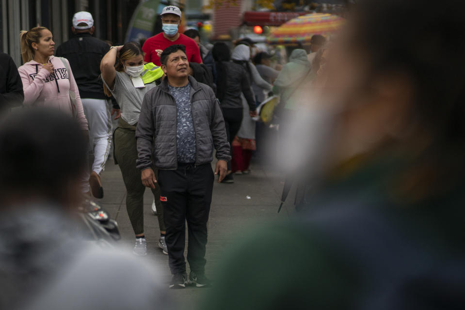 Ecuadorian immigrant Neptali Chiluisa walks around the borough of Bronx on Monday, Oct. 25, 2021, in New York. Chiluisa crossed the border in June in Arizona and was detained for a week with his 14-year-old son, leaving behind his wife and three other children in Ecuador. The son returned in August because Chiluisa had to work and couldn’t find a nearby school with space. (AP Photo/Eduardo Munoz Alvarez)