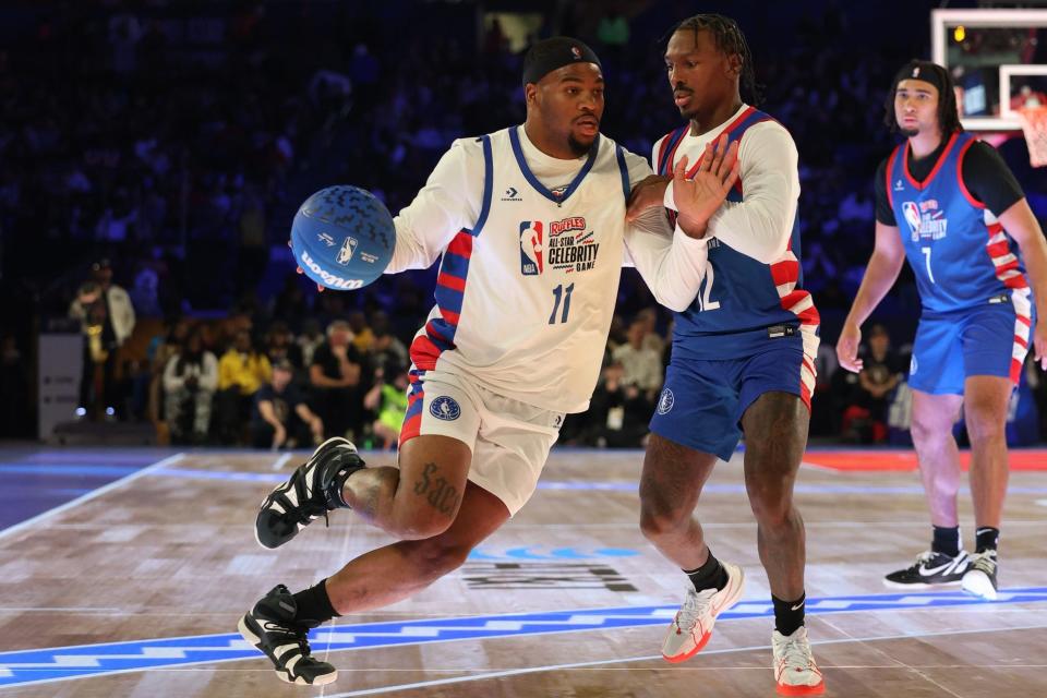 Feb 16, 2024; Indianapolis, IN, USA; Michah Parsons (11) of Team Shannon drives against Mecole Hardman Jr. (12) of Team Stephen A in the second half during the All Star Celebrity Game at Lucas Oil Stadium. Mandatory Credit: Trevor Ruszkowski-USA TODAY Sports