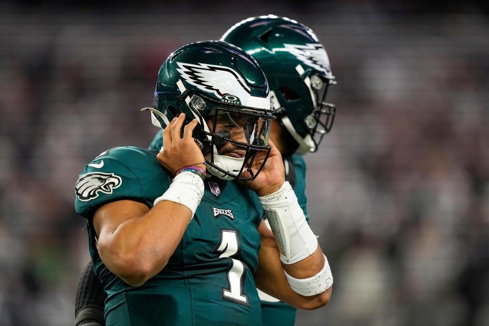 Philadelphia Eagles quarterback Jalen Hurts (1) reacts after losing a fumble against the Dallas Cowboys during the first half of an NFL football game, Sunday, Dec. 10, 2023, in Arlington, Texas. (AP Photo/Tony Gutierrez)