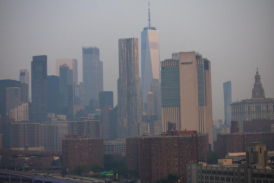 The Manhattan skyline is seen during sunrise amid hazy conditions due to smoke from Canadian wildfires on Thursday.