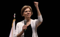 FILE - In this Aug. 8, 2018 file photo, U.S. Sen. Elizabeth Warren, D-Mass., gestures during a town hall style gathering in Woburn, Mass. She took the DNA test President Donald Trump urged. She’s hitting back in personal terms, calling him “creepy” on Twitter, in real time. And she’s not backing down. When it comes to challenging the man who redefined the rules of American political combat, Warren in some ways is doing it Trump’s way. She’s getting some backlash from Native Americans and grumbling from Democrats who’d rather be talking about toppling Congress’ Republican majorities in the midterm elections three weeks away. (AP Photo/Charles Krupa, File )