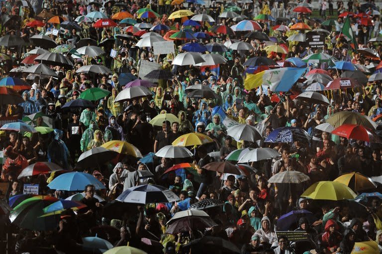 Supporters of the opposition gather at a stadium in Kelana Jaya, Selangor, Malaysia on May 8, 2013. Vowing to "never surrender", opposition leader Anwar Ibrahim called on Malaysians Wednesday to join in a nationwide protest tour against elections he said were stolen from the country's people