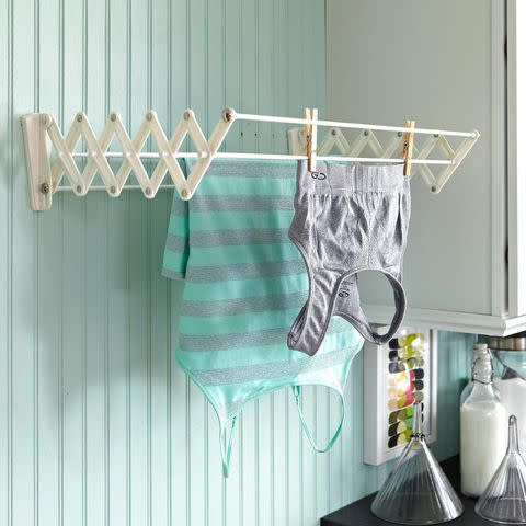 Jay Wilde Hanging clothes to dry rather than tossing them in the dryer can prevent shrinking, fading, and other damage caused by heat.