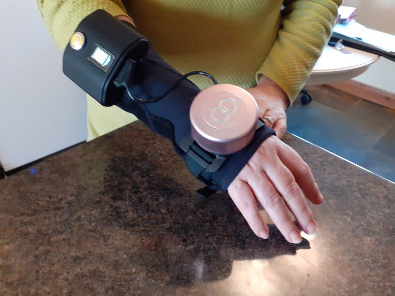 Glove with built-in spinning gyroscope for Parkinson's disease shaking near Towcester