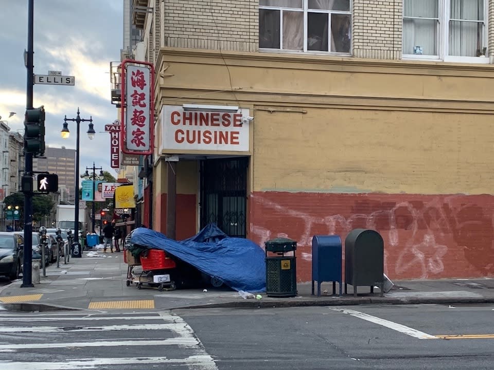 An encampment blocks the doorway of a restaurant at Ellis and Larkin streets.